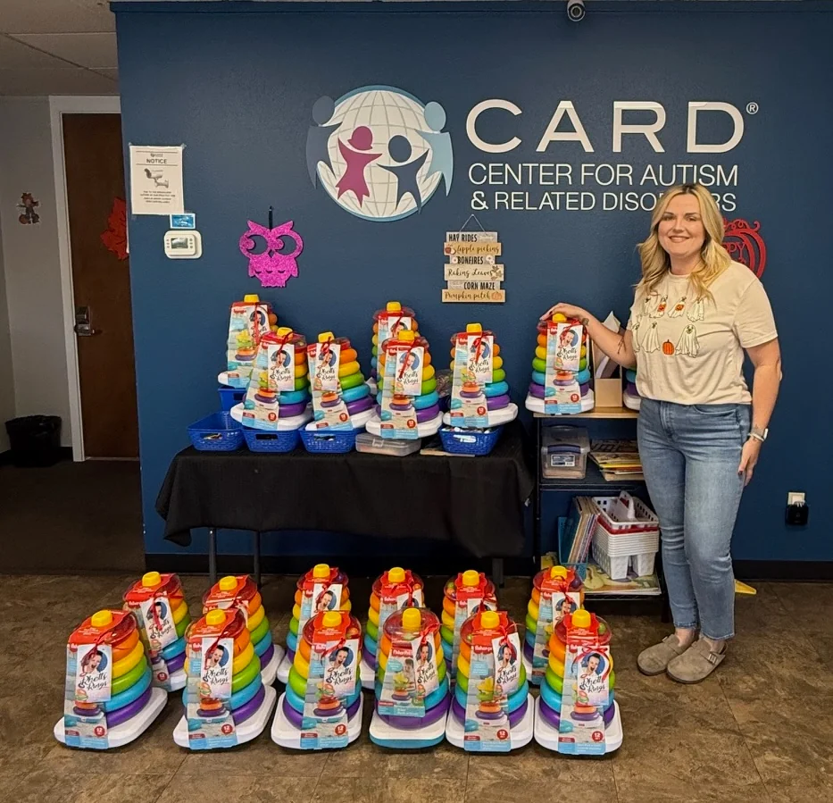 Child smiling with donated support toys
